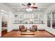 Elegant living room with custom built-ins, granite countertops, ceiling fan, and traditional-style furnishings at 2580 Defoors Ferry Nw Rd, Atlanta, GA 30318