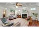 Warm living room with fireplace, hardwood floors, and comfortable seating arrangement at 2580 Defoors Ferry Nw Rd, Atlanta, GA 30318