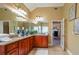 Bathroom with dual sinks, granite counters, tile floor, and decor at 3230 Letha Woods Dr, Conyers, GA 30094
