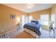 Comfortable bedroom features natural light, neutral colors, and carpeted floor at 3230 Letha Woods Dr, Conyers, GA 30094