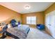 Comfortable bedroom featuring carpet, neutral paint, a double bed, and natural light from a window at 3230 Letha Woods Dr, Conyers, GA 30094