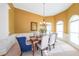 Dining room with elegant chairs, chandelier, and natural light at 3230 Letha Woods Dr, Conyers, GA 30094