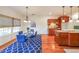 Open kitchen and dining area with stainless appliances and hardwood floors at 3230 Letha Woods Dr, Conyers, GA 30094