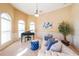 Cozy living area with piano, sofa, and natural light at 3230 Letha Woods Dr, Conyers, GA 30094