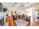 Spacious living room with fireplace, wood floors and lots of natural light at 3230 Letha Woods Dr, Conyers, GA 30094