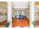 Open-concept living room with hardwood floors, fireplace, and coffered ceiling at 3230 Letha Woods Dr, Conyers, GA 30094