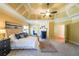 Luxurious main bedroom with trey ceilings, seating area, and ensuite bathroom at 3230 Letha Woods Dr, Conyers, GA 30094