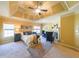 Spacious main bedroom features tray ceilings, fireplace, and comfortable seating area at 3230 Letha Woods Dr, Conyers, GA 30094
