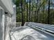 Spacious back deck with built-in seating and views of the surrounding wooded area at 3861 Spring Meadow Dr, Acworth, GA 30101