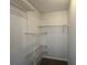 A walk-in closet featuring multiple adjustable wire shelves for ample storage at 3861 Spring Meadow Dr, Acworth, GA 30101