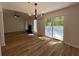 Open concept dining room adjacent to the living room with sliding doors at 3861 Spring Meadow Dr, Acworth, GA 30101