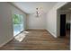 Bright dining room with sliding glass doors and modern chandelier at 3861 Spring Meadow Dr, Acworth, GA 30101