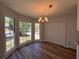 Bright dining area with large windows and a view of the front yard, with a pantry closet at 3861 Spring Meadow Dr, Acworth, GA 30101