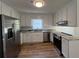 Kitchen featuring stainless steel appliances, granite countertops, and bright white cabinets at 3861 Spring Meadow Dr, Acworth, GA 30101