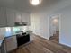 Bright kitchen featuring stainless steel appliances, granite countertops, and pantry at 3861 Spring Meadow Dr, Acworth, GA 30101