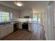 Well-lit kitchen with stainless steel appliances, granite countertops, and bright white cabinets at 3861 Spring Meadow Dr, Acworth, GA 30101