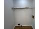 Small, unfinished laundry room with hookups and laminate flooring at 3861 Spring Meadow Dr, Acworth, GA 30101