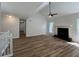 Spacious living room with new flooring, a modern fireplace, and plenty of natural light at 3861 Spring Meadow Dr, Acworth, GA 30101