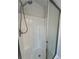 White fiberglass shower with sliding glass doors and chrome fixtures at 3861 Spring Meadow Dr, Acworth, GA 30101