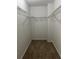 Empty walk-in closet features wire shelving and carpet at 3861 Spring Meadow Dr, Acworth, GA 30101