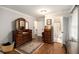Bedroom featuring hardwood floors and an attached bathroom at 4715 Howard Dr, Powder Springs, GA 30127