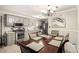 Bright kitchen featuring gray cabinets, granite countertops, stainless steel appliances, and a dining area at 4715 Howard Dr, Powder Springs, GA 30127