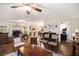 Open-concept living room with hardwood floors, fireplace, adjacent to kitchen and bedroom, perfect for modern living at 4715 Howard Dr, Powder Springs, GA 30127