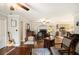 Spacious living room with hardwood floors, fireplace, and views to the kitchen, perfect for entertaining and relaxing at 4715 Howard Dr, Powder Springs, GA 30127