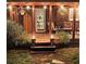 Inviting outdoor patio illuminated with string lights, features comfortable seating and manicured landscaping at 4715 Howard Dr, Powder Springs, GA 30127