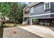 Spacious backyard with a patio, grassy area, and a covered carport with a ping pong table at 144 Park Dr, Decatur, GA 30030