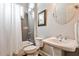 Well-lit bathroom with a pedestal sink, gray subway tile, a white shower curtain and modern fixtures create a clean aesthetic at 144 Park Dr, Decatur, GA 30030
