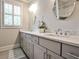 Bright bathroom featuring double vanity with white marble countertop, framed mirrors, and great storage space at 144 Park Dr, Decatur, GA 30030