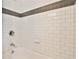 Bathroom with white subway tile, a neutral accent stripe, and stylish fixtures create a timeless design at 144 Park Dr, Decatur, GA 30030