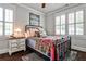 Charming bedroom with dark wood floors, a metal frame bed, an area rug, and an accent lamp at 144 Park Dr, Decatur, GA 30030