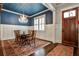 Elegant dining room with a chandelier and a blue ceiling at 144 Park Dr, Decatur, GA 30030
