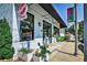 Opo Coffee shop exterior with a clean white brick facade, black awning, and outdoor seating at 144 Park Dr, Decatur, GA 30030