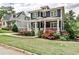 Beautiful two-story home with a front porch, lush landscaping, and green lawn at 144 Park Dr, Decatur, GA 30030