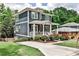 Charming two-story home with a welcoming front porch and well-manicured landscaping at 144 Park Dr, Decatur, GA 30030