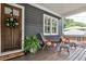 Inviting front porch featuring comfortable seating and a beautifully decorated entrance at 144 Park Dr, Decatur, GA 30030