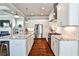 Bright kitchen featuring a large island, stainless steel appliances, and white cabinetry at 144 Park Dr, Decatur, GA 30030