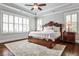 Bright and airy main bedroom showcasing natural light, a ceiling fan, and sophisticated design at 144 Park Dr, Decatur, GA 30030