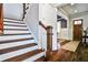 Staircase features hardwood steps and white risers, leading to an entryway with hardwood floors at 144 Park Dr, Decatur, GA 30030