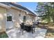 Cozy backyard patio with an outdoor dining set and grill, perfect for entertaining and enjoying the outdoor space at 2505 Rockmart Rd, Villa Rica, GA 30180