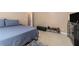 Bedroom featuring a comfortable bed, dresser, and natural light at 2505 Rockmart Rd, Villa Rica, GA 30180