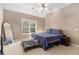 Cozy bedroom with neutral tones, carpet floors, and comfortable bed at 2505 Rockmart Rd, Villa Rica, GA 30180