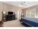 Bright bedroom with vaulted ceiling, neutral tones, and a view of the outdoors at 2505 Rockmart Rd, Villa Rica, GA 30180