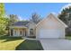 Charming single-story home with well-manicured lawn and attached two-car garage at 2505 Rockmart Rd, Villa Rica, GA 30180
