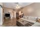 Cozy living room featuring hardwood floors, a ceiling fan, and comfortable seating at 2505 Rockmart Rd, Villa Rica, GA 30180