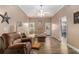 Comfortable living room with hardwood floors, a ceiling fan, and lots of natural light at 2505 Rockmart Rd, Villa Rica, GA 30180