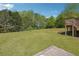 Expansive backyard featuring a lush lawn and mature trees, providing a private and serene outdoor space at 2816 Pine Meadow Dr, Marietta, GA 30066